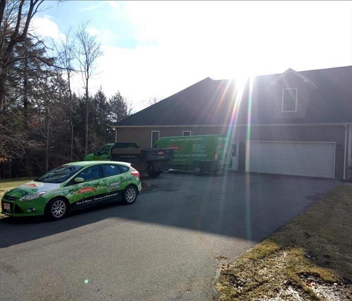 SERVPRO cars on site of a loss.