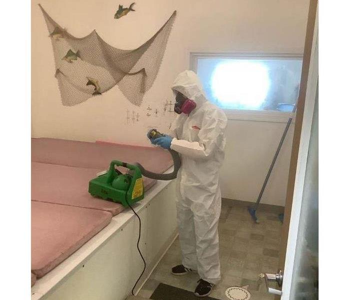 SERVPRO employee ready to use our fogging technique to rid this home of any pathogens