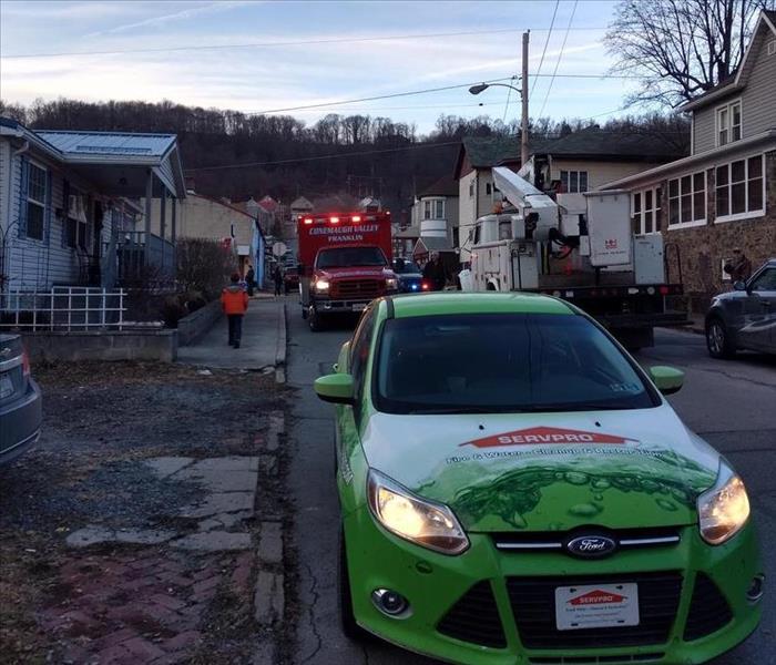 SERVPRO car and fire truck.